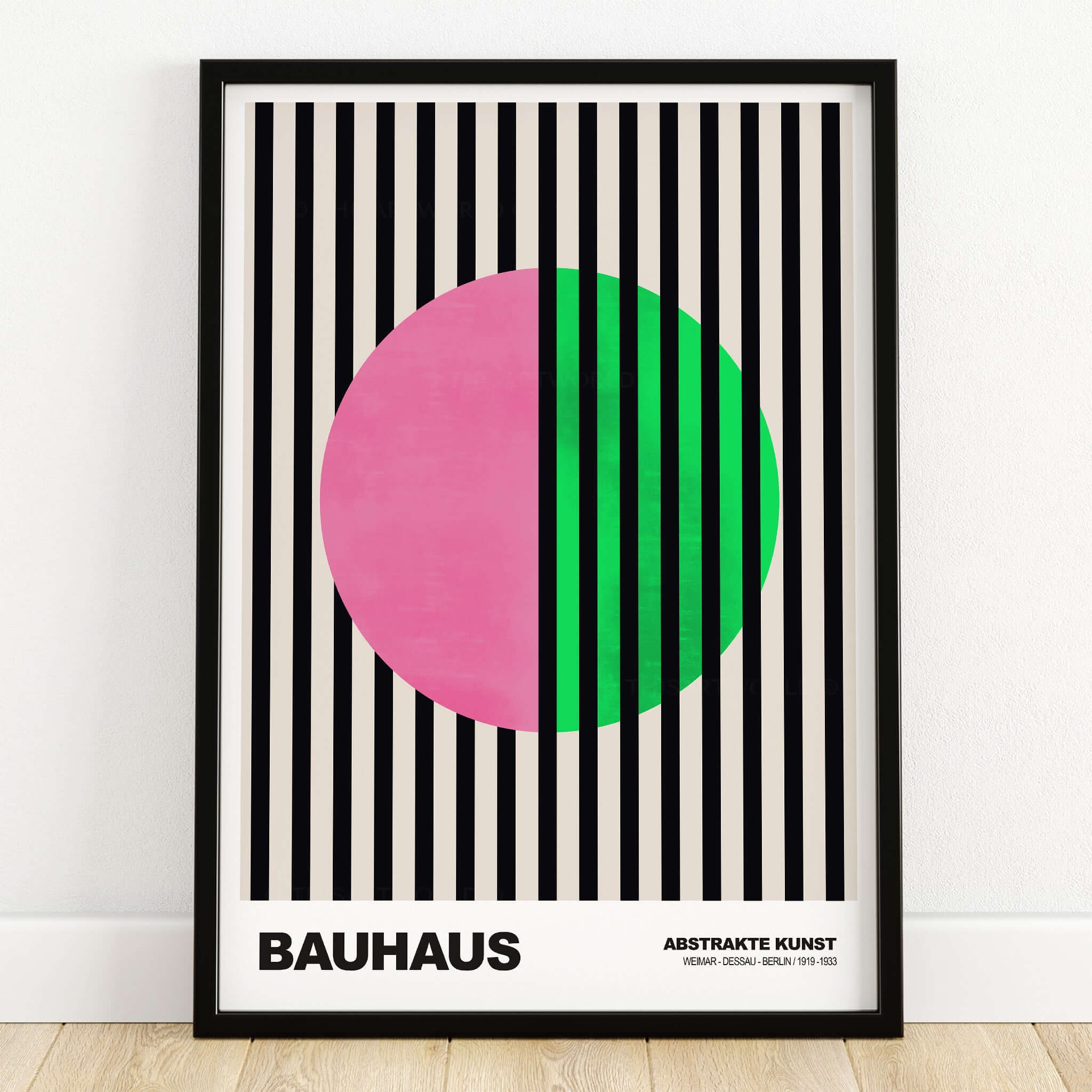 Bauhaus Exhibition Prints - Split Circle Abstract Art Print Pink Green Stripes in a frame with black and cream stripes.