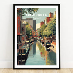 Birmingham England canal art print in black frame on wooden floor, skyline and boats