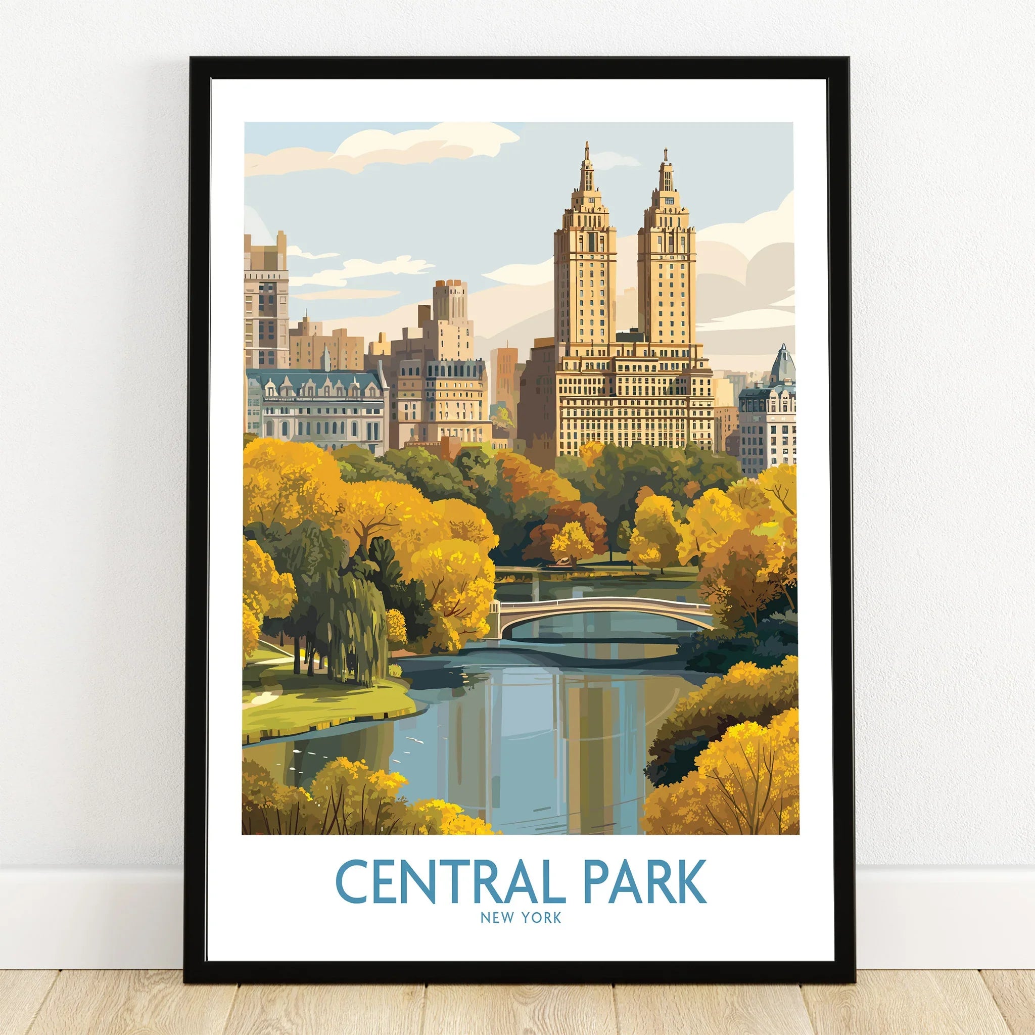 Central Park art print in black frame, featuring skyline, autumn trees, and lake scene.