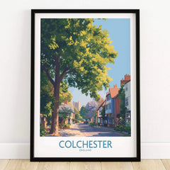 Colchester England art print in black frame, showing a scenic street with trees and historic buildings