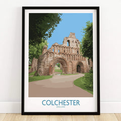 Framed Colchester England travel poster with historic ruins artwork on wooden floor