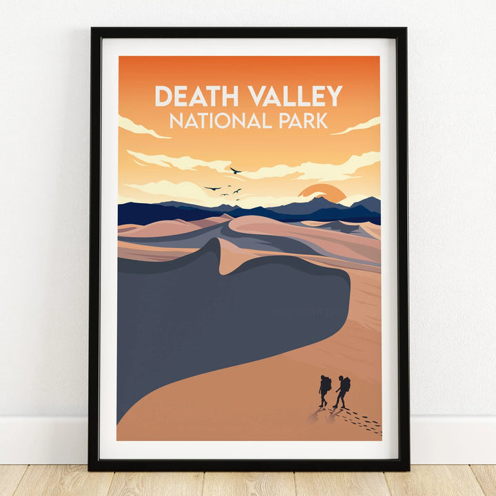 Death Valley National Park art print in black frame, desert landscape with hikers and sunrise