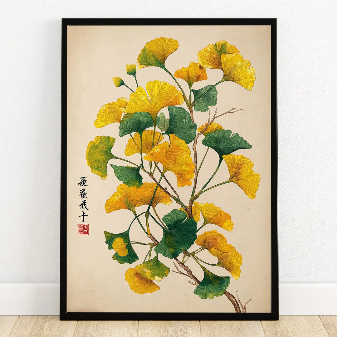 Ginkgo botanical art print in black frame on wooden floor, yellow and green leaves, wall decor