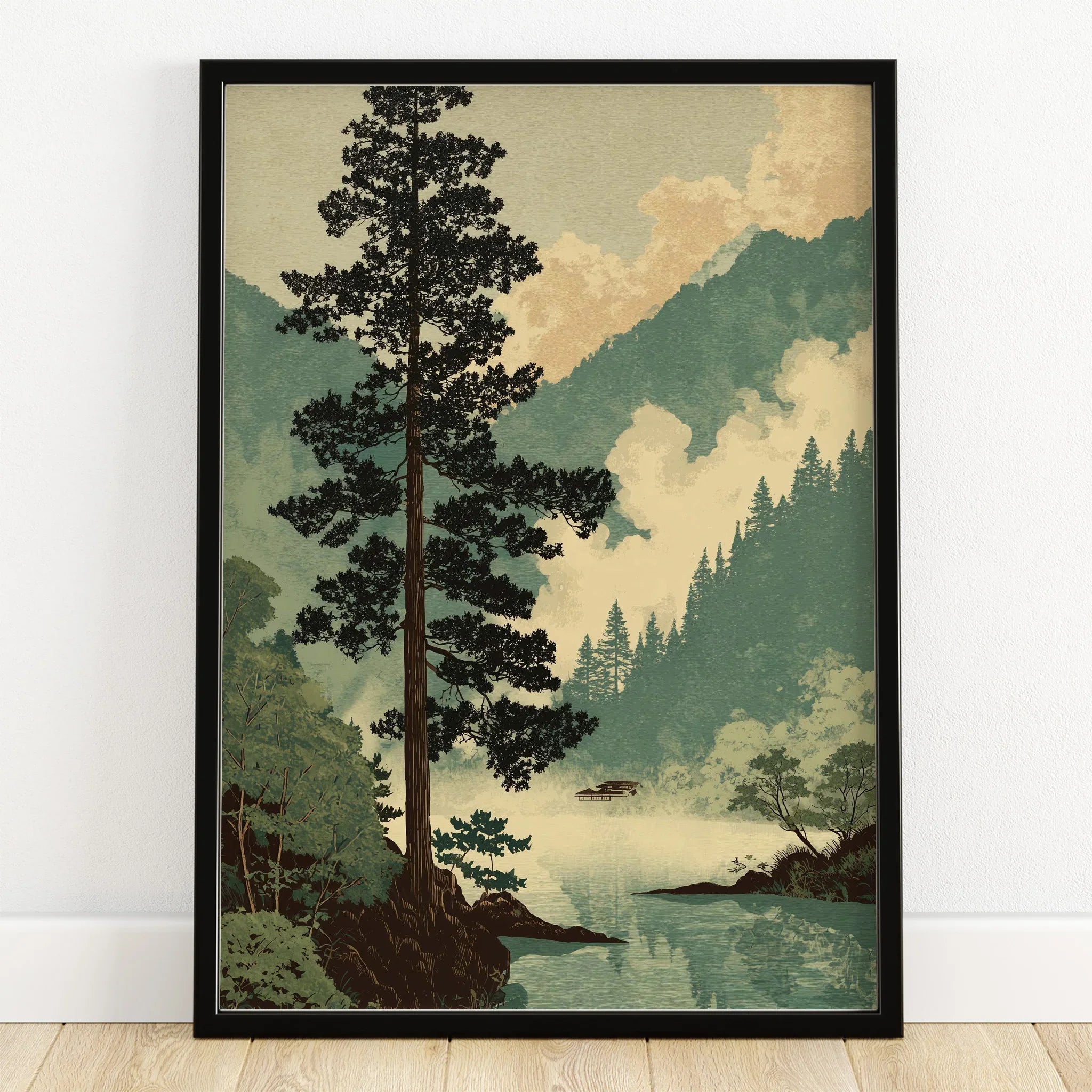 Japanese woodblock style art print of a pine tree and misty mountains in black frame