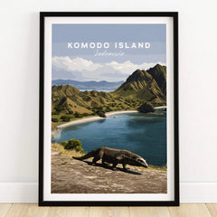 Komodo Island Indonesia travel poster print in black frame on wooden floor, featuring Komodo dragon and scenic coastal landscape.