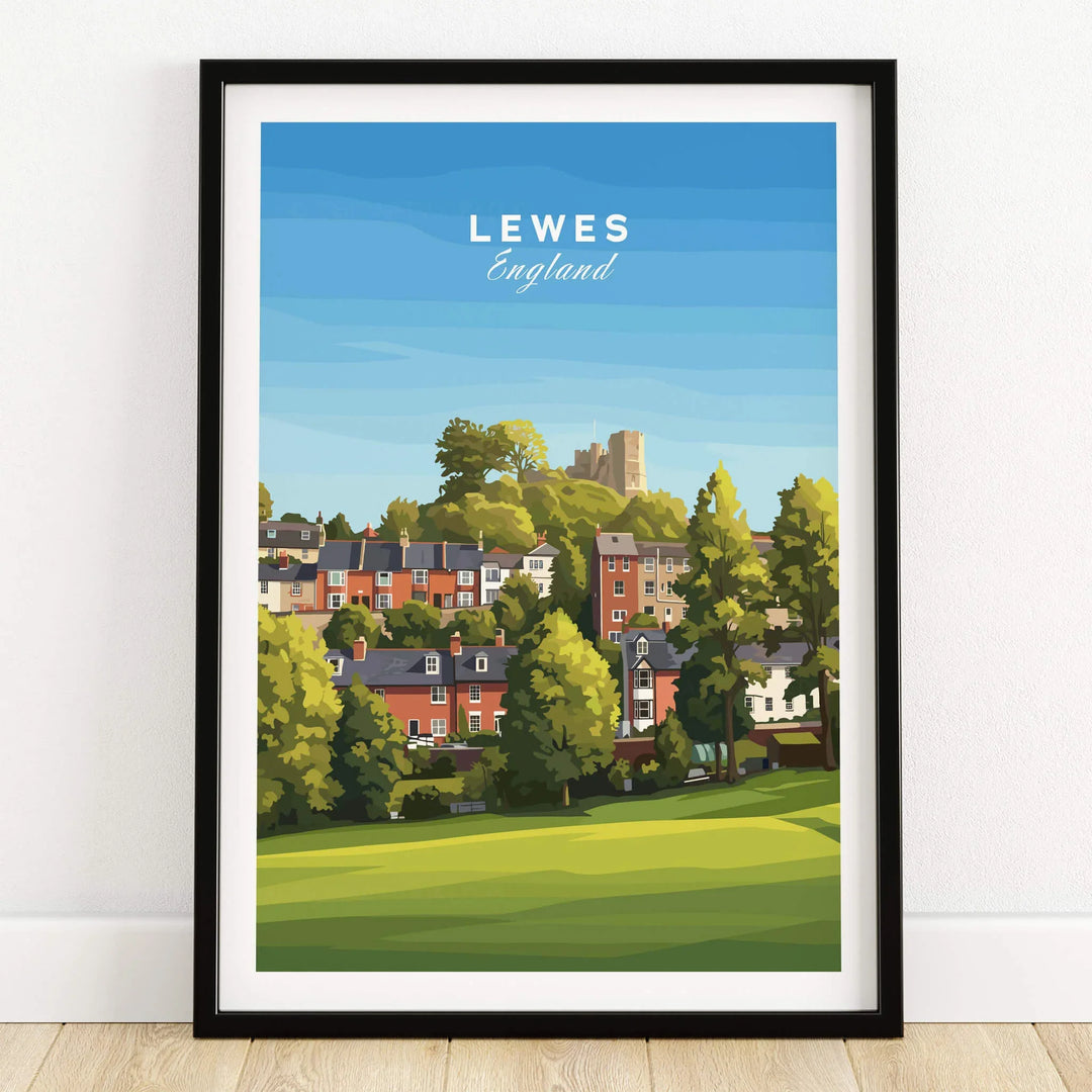 Lewes England art print in black frame, featuring colorful houses, trees, and a castle.