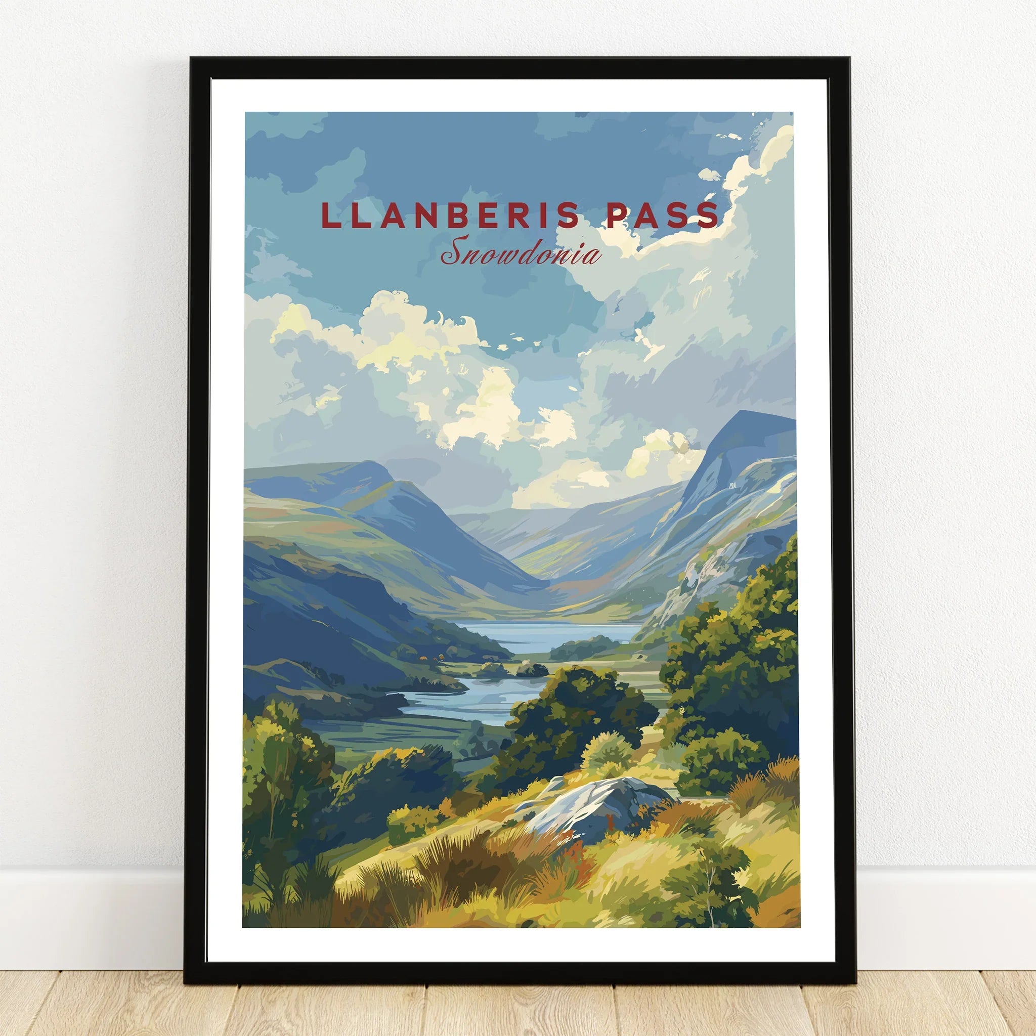 Llanberis Pass Snowdonia travel poster art print in black frame on wooden floor