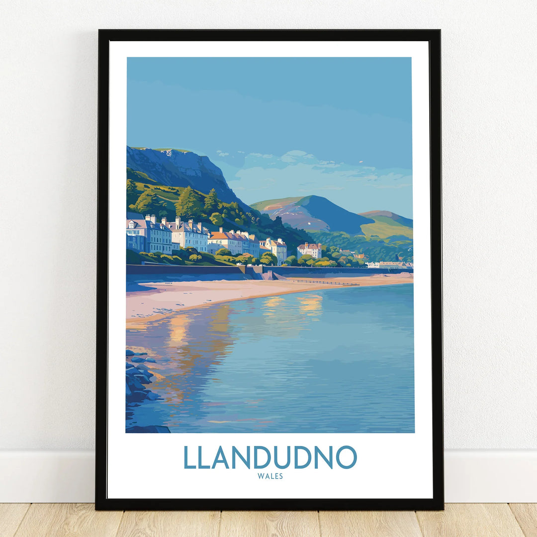 Llandudno art print in black frame, showing coastal town, beach, and mountains.