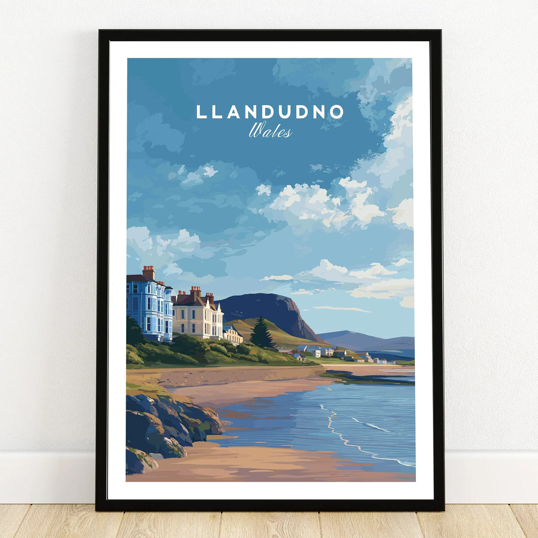 Llandudno Wales art print in black frame showing seaside town, beach, and blue sky.