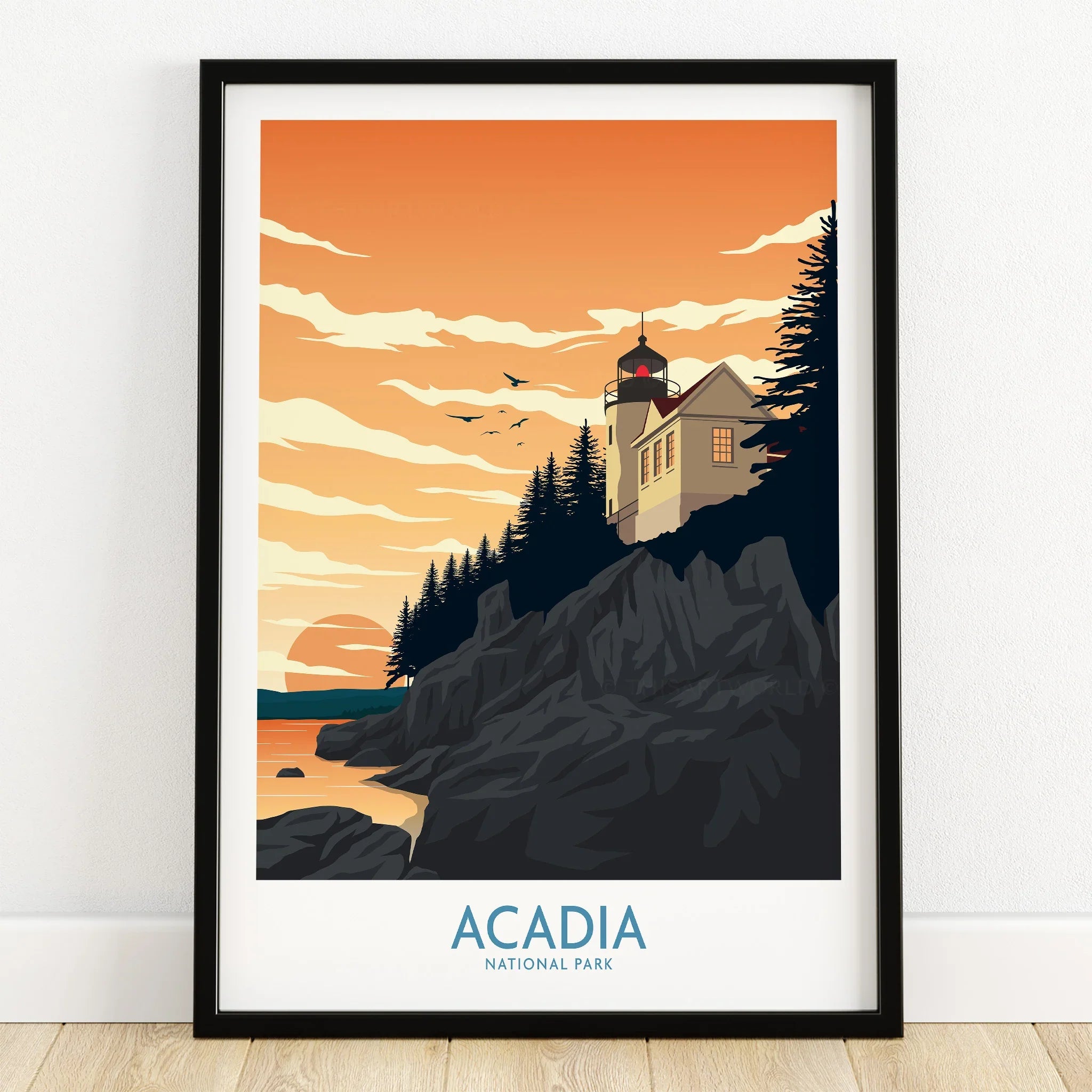 Acadia National Park art print in black frame, featuring a coastal lighthouse at sunset.