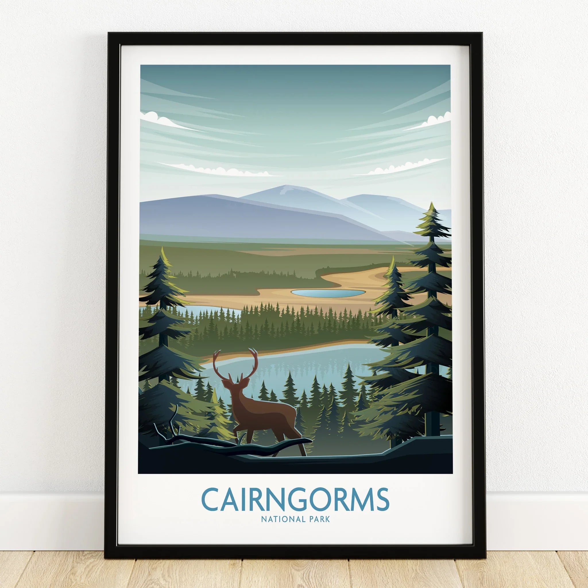 Cairngorms National Park art print with stag, mountains, lake, and pine trees in black frame