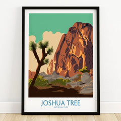 Joshua Tree National Park art print in black frame on wooden floor, featuring desert landscape.