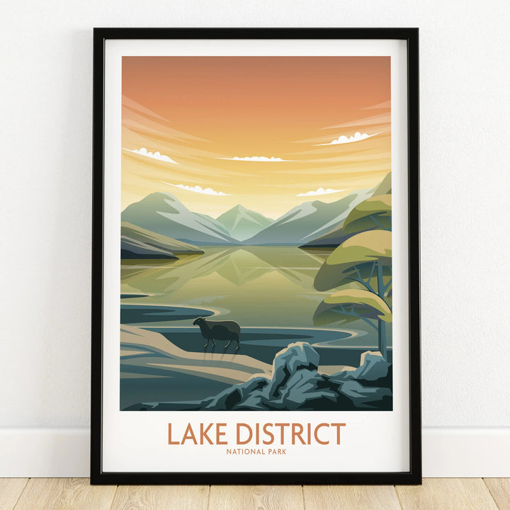 Lake District National Park travel poster print in black frame, landscape with mountains, lake, and silhouette of a ram, leaning on a wooden floor.