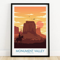 Monument Valley art print in black frame, sunset scene with buttes and cowboy silhouette