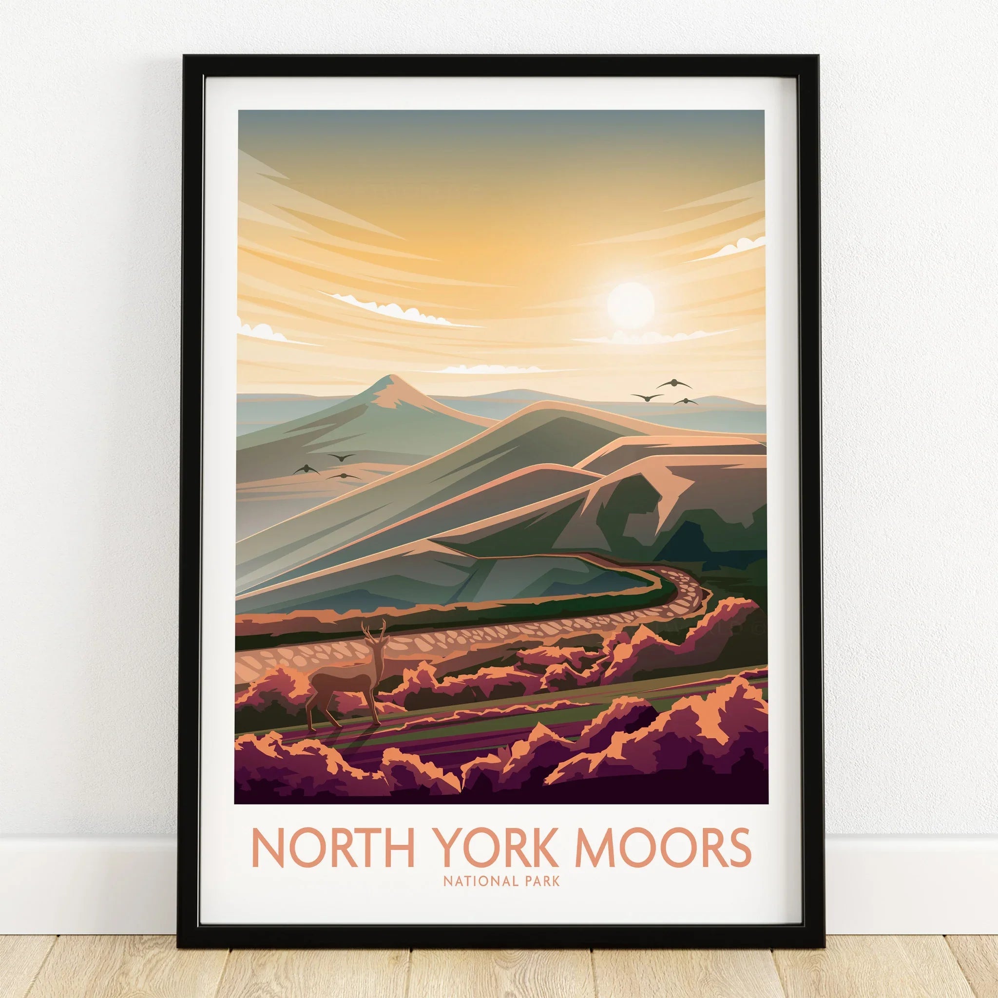 North York Moors National Park art print in black frame on wooden floor, landscape design