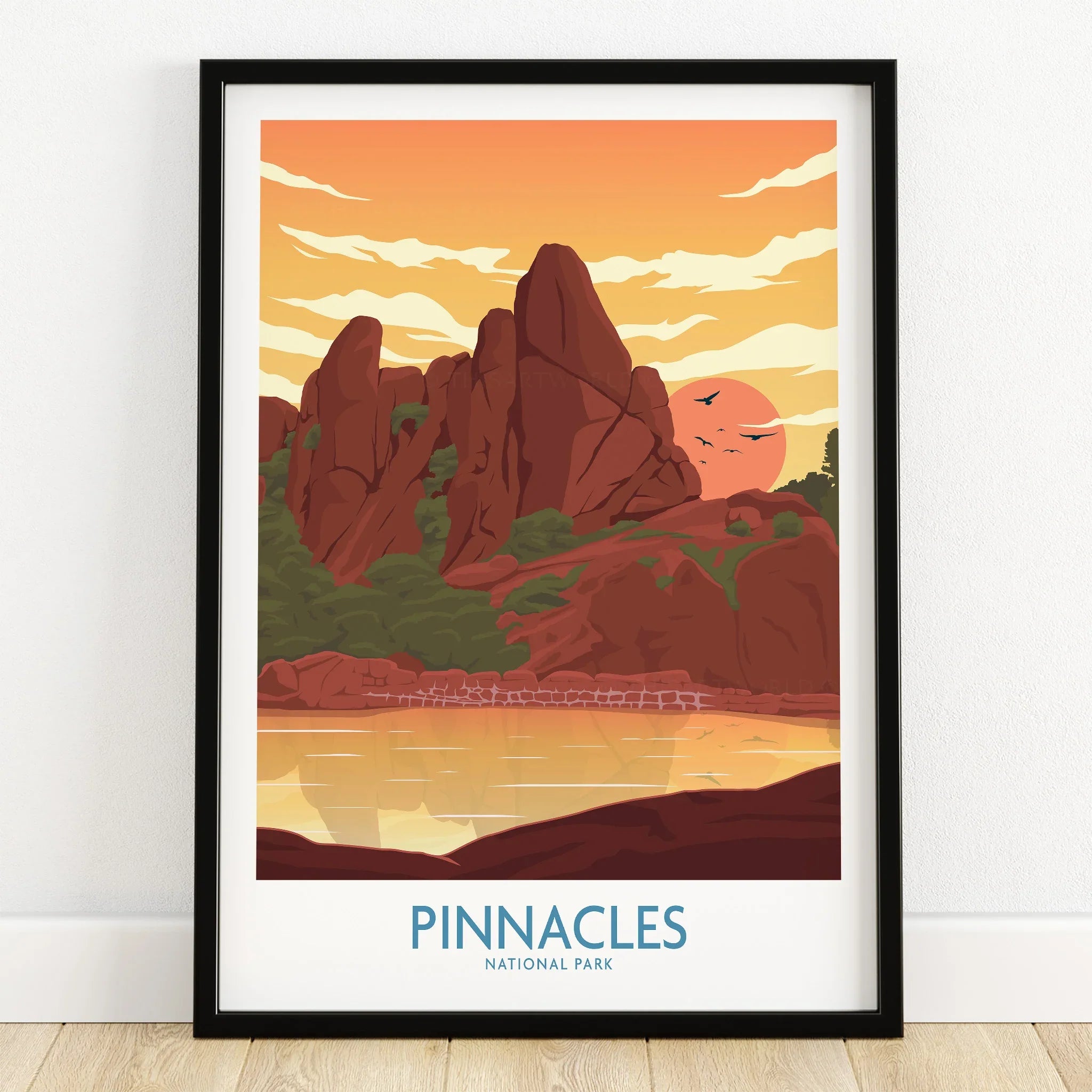 Framed Pinnacles National Park art print with red rock formations at sunset on wooden floor
