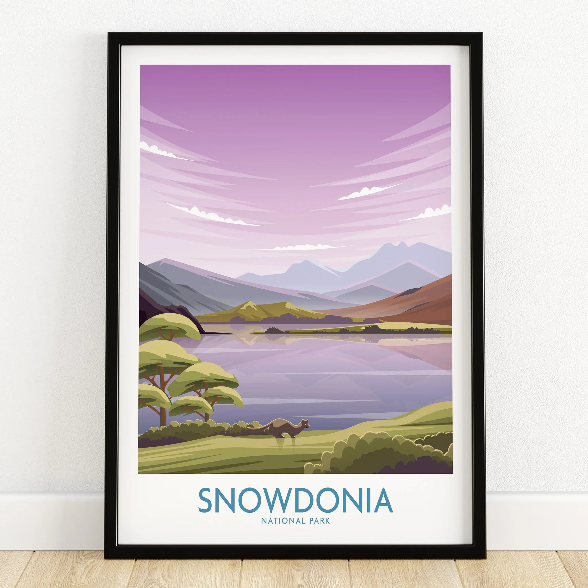 Snowdonia National Park art print in black frame, featuring mountains, lake, and trees