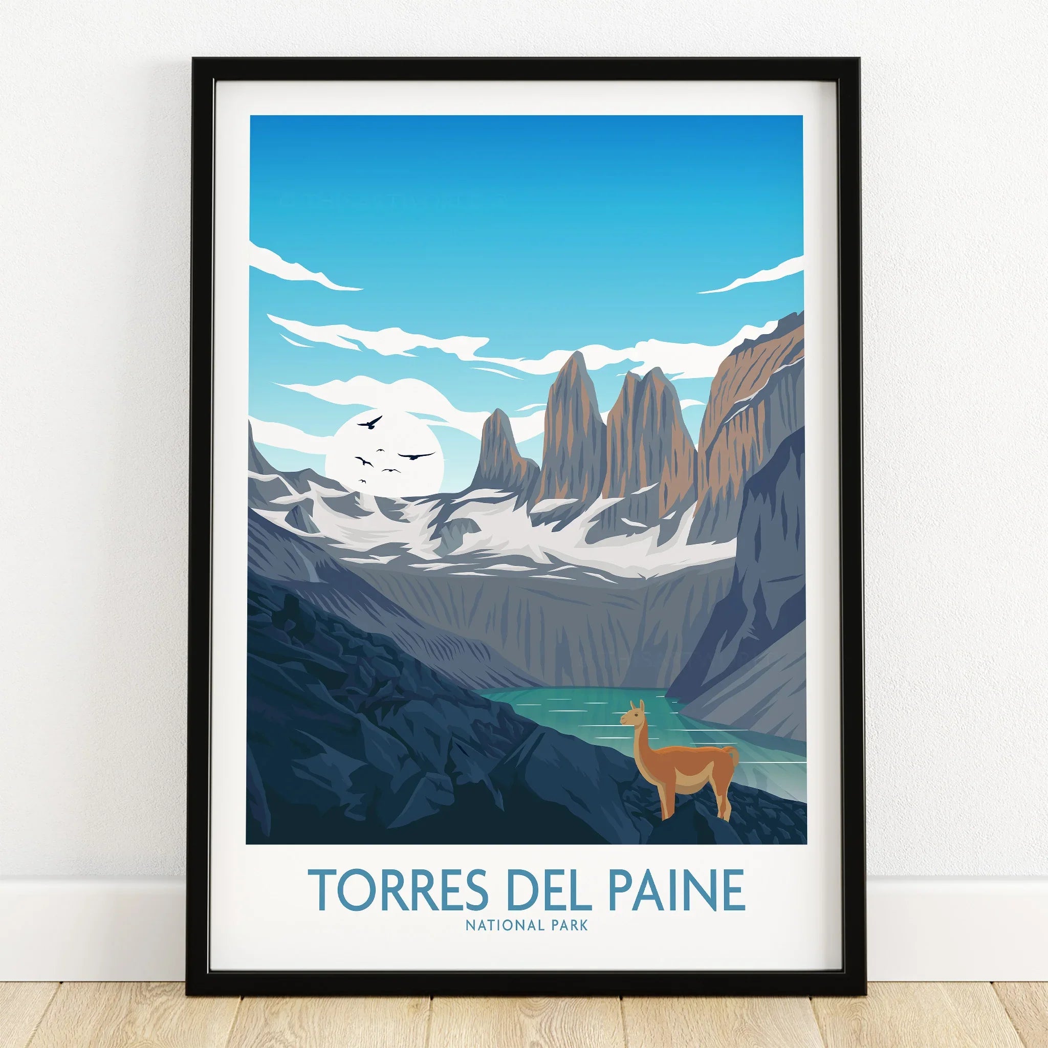 Torres del Paine art print in black frame, featuring mountains, lake, and guanaco