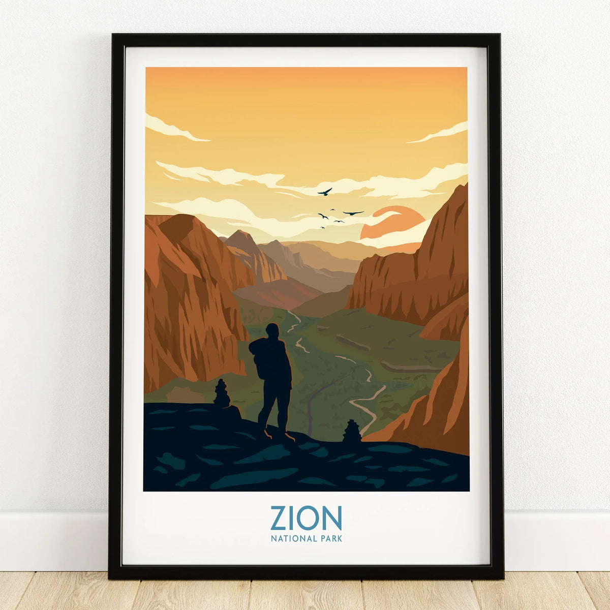 Zion National Park art print with hiker silhouette, scenic canyon, and sunset in black frame