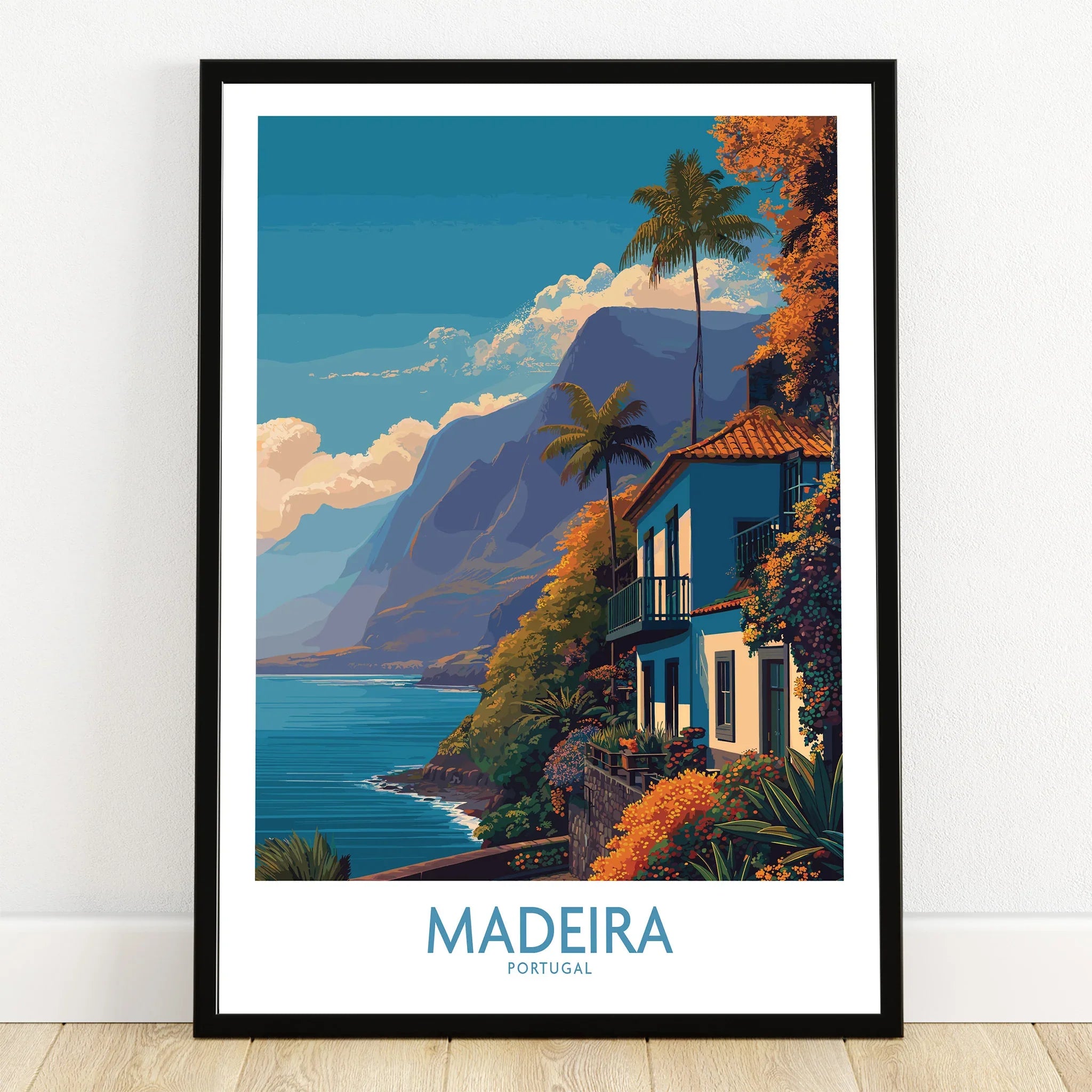 Madeira travel poster art print in black frame showing coastal mountains and vibrant home