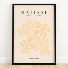 Matisse Art Prints - Pale Peach Abstract Shapes Wall Art in a black frame showcasing elegant leaf shapes.