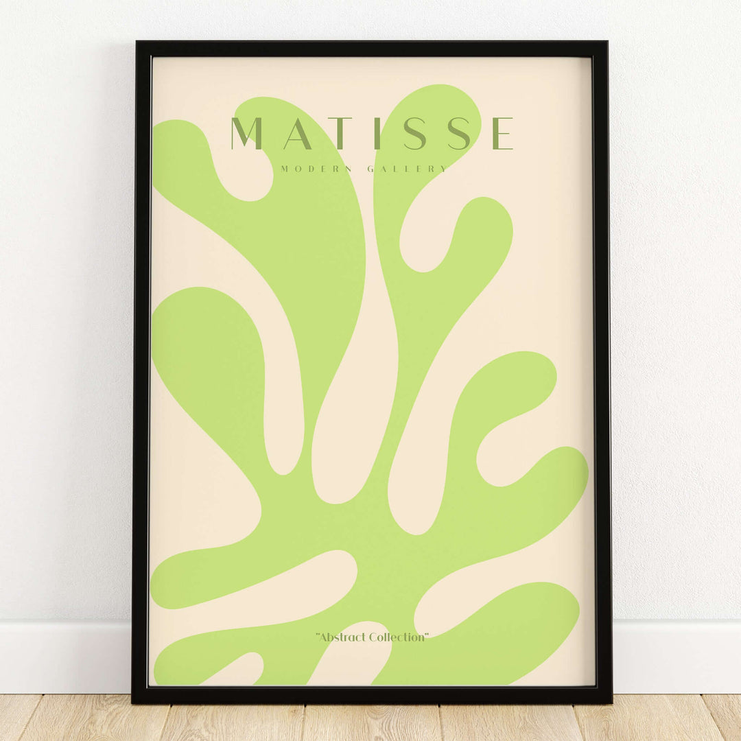 Matisse Art Prints - Lime Green Abstract Coral Shape Poster displayed in a black frame, featuring vibrant cut-out style design.