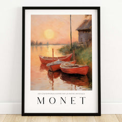 Claude Monet Art Print - Red Boats at Sunset Riverbank Wall Art featuring three red boats and a sunset.