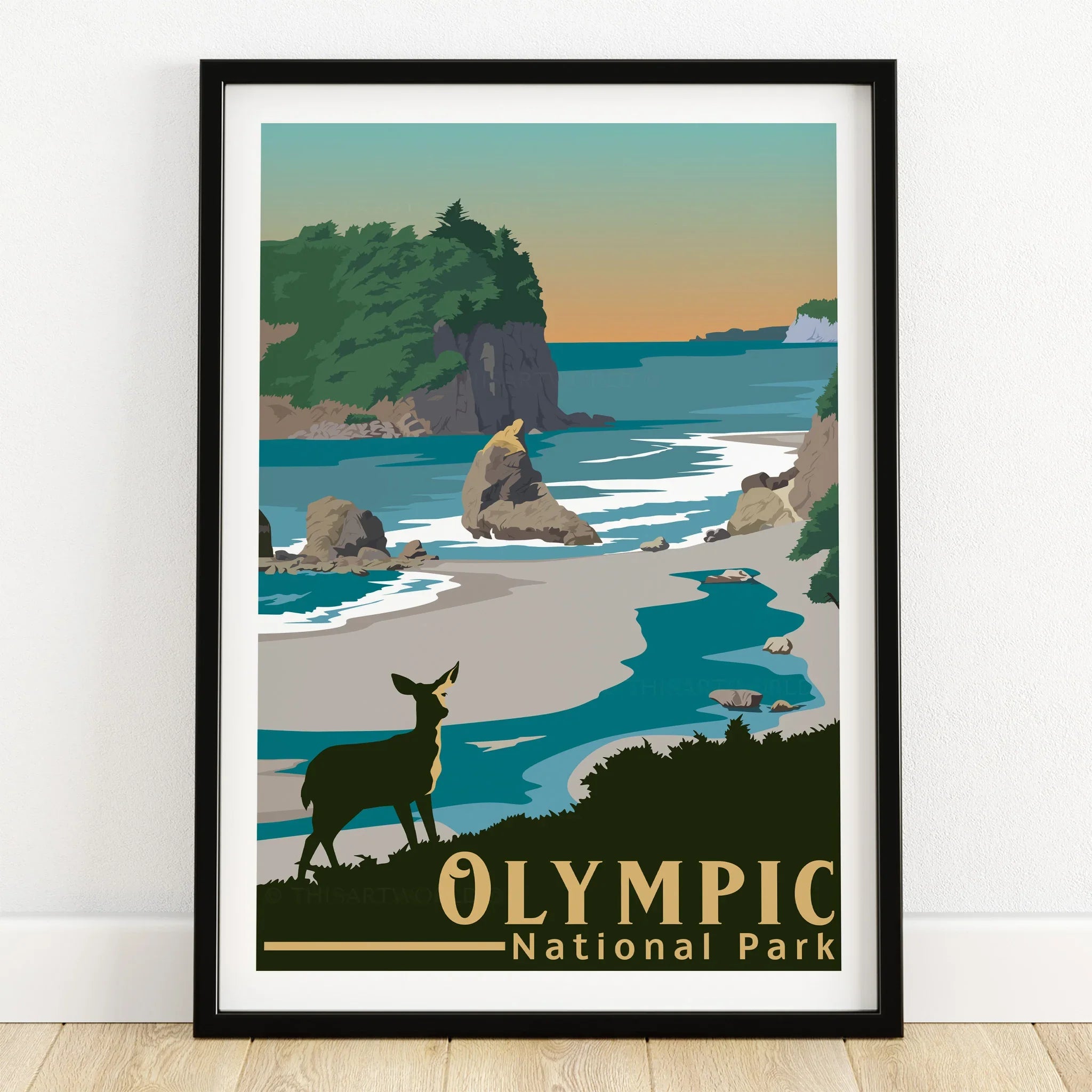 Olympic National Park art print in black frame, coastal landscape with deer, on wooden floor