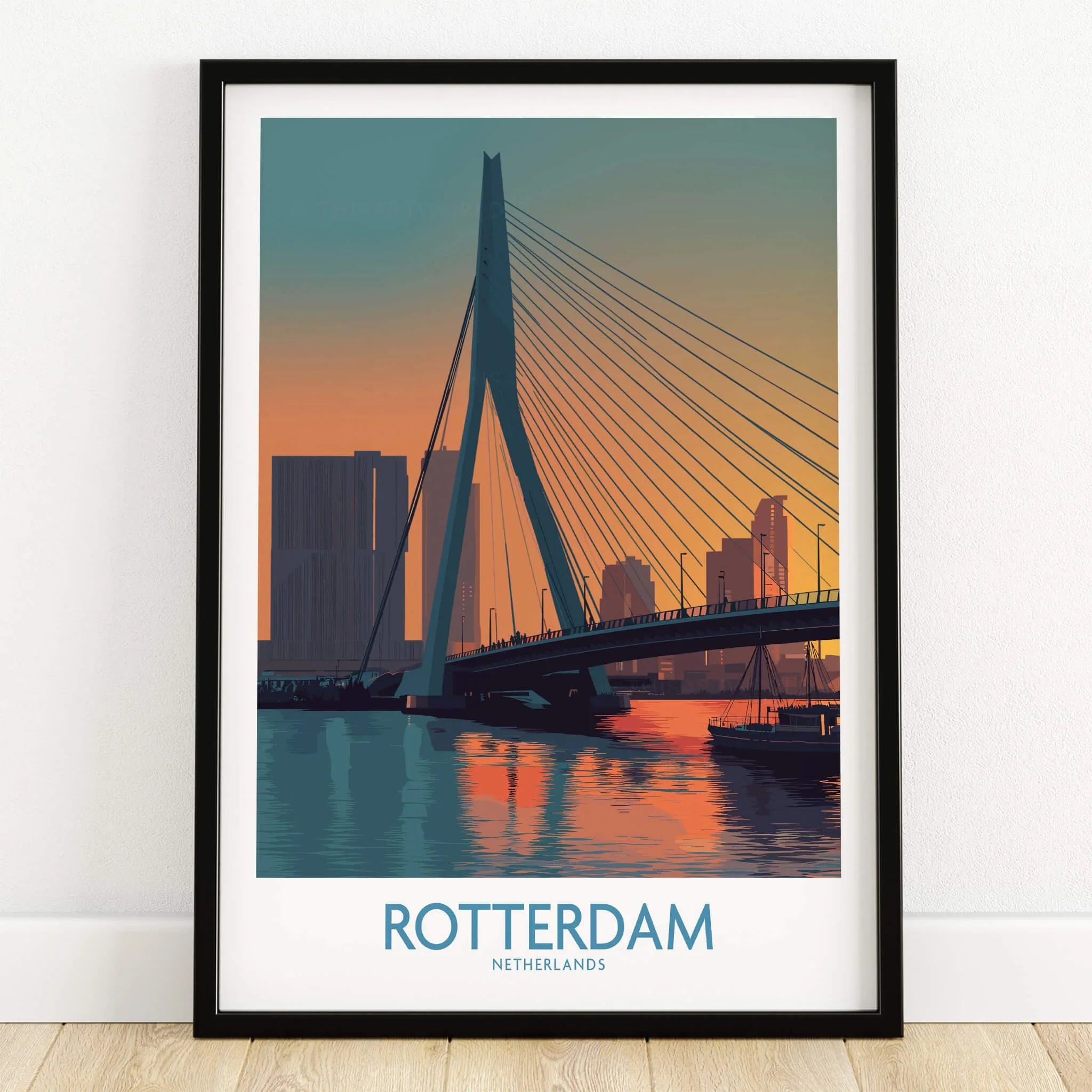 Rotterdam travel poster art print in black frame, city skyline and bridge at sunset on wooden floor