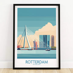 Rotterdam skyline art print in black frame, featuring cityscape and bridge, on wooden floor