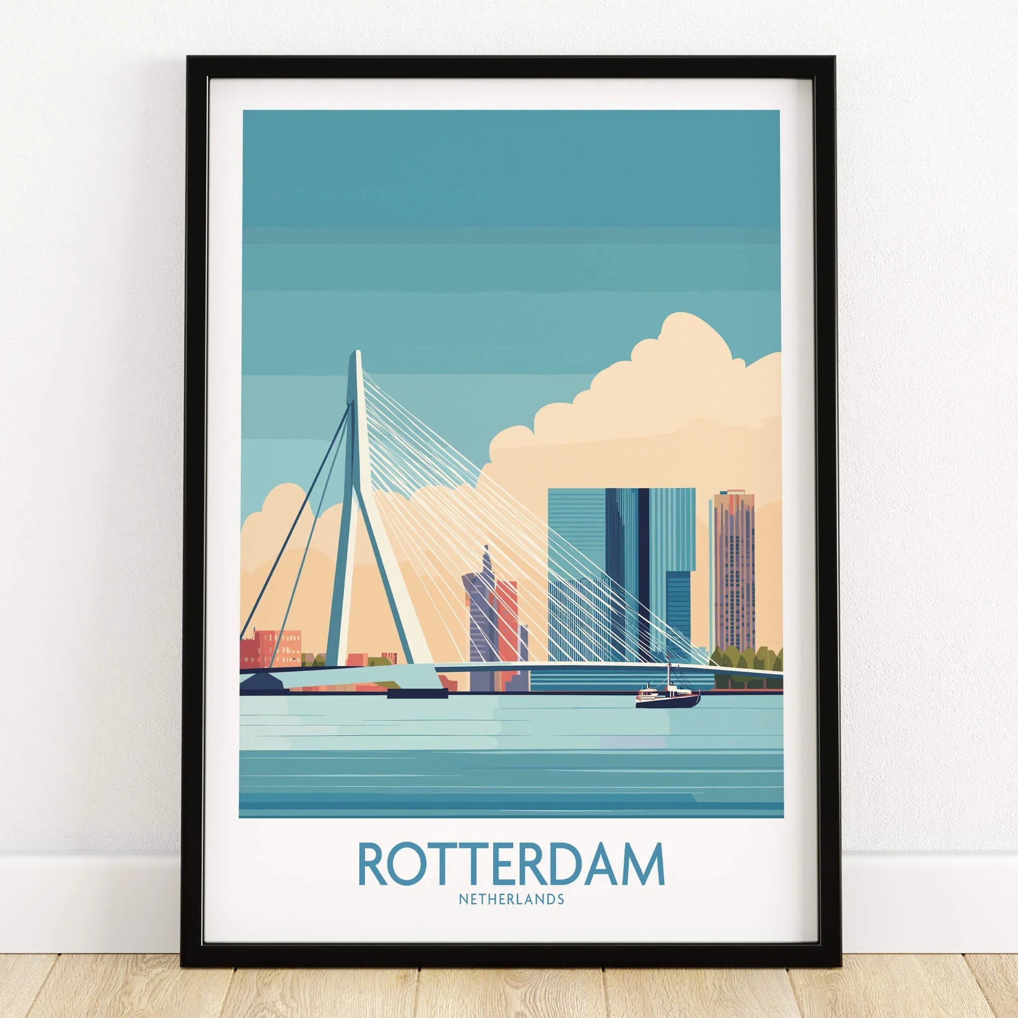 Rotterdam skyline art print in black frame, featuring cityscape and bridge, on wooden floor
