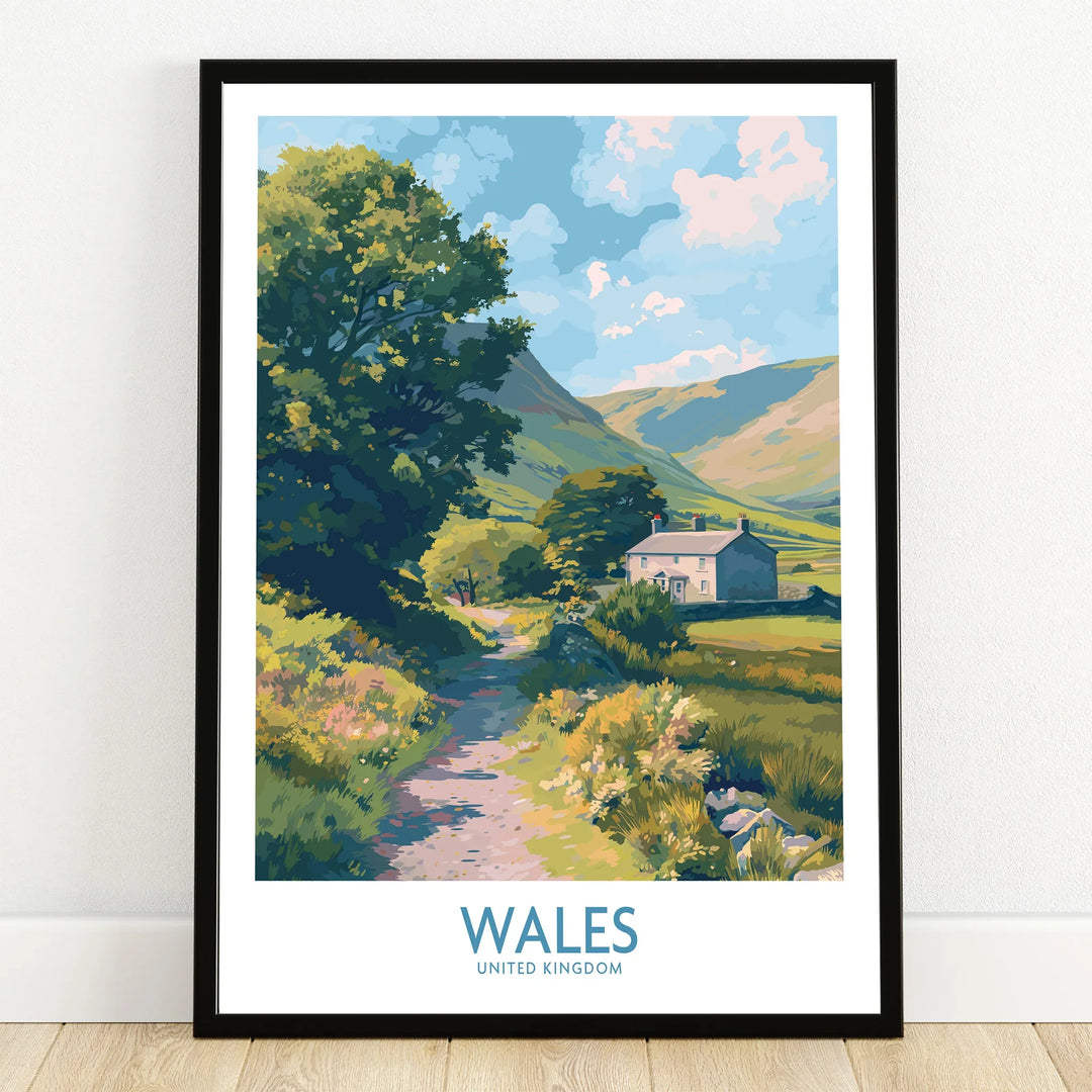 Wales art print in black frame, featuring countryside landscape with cottage, tree, and hills