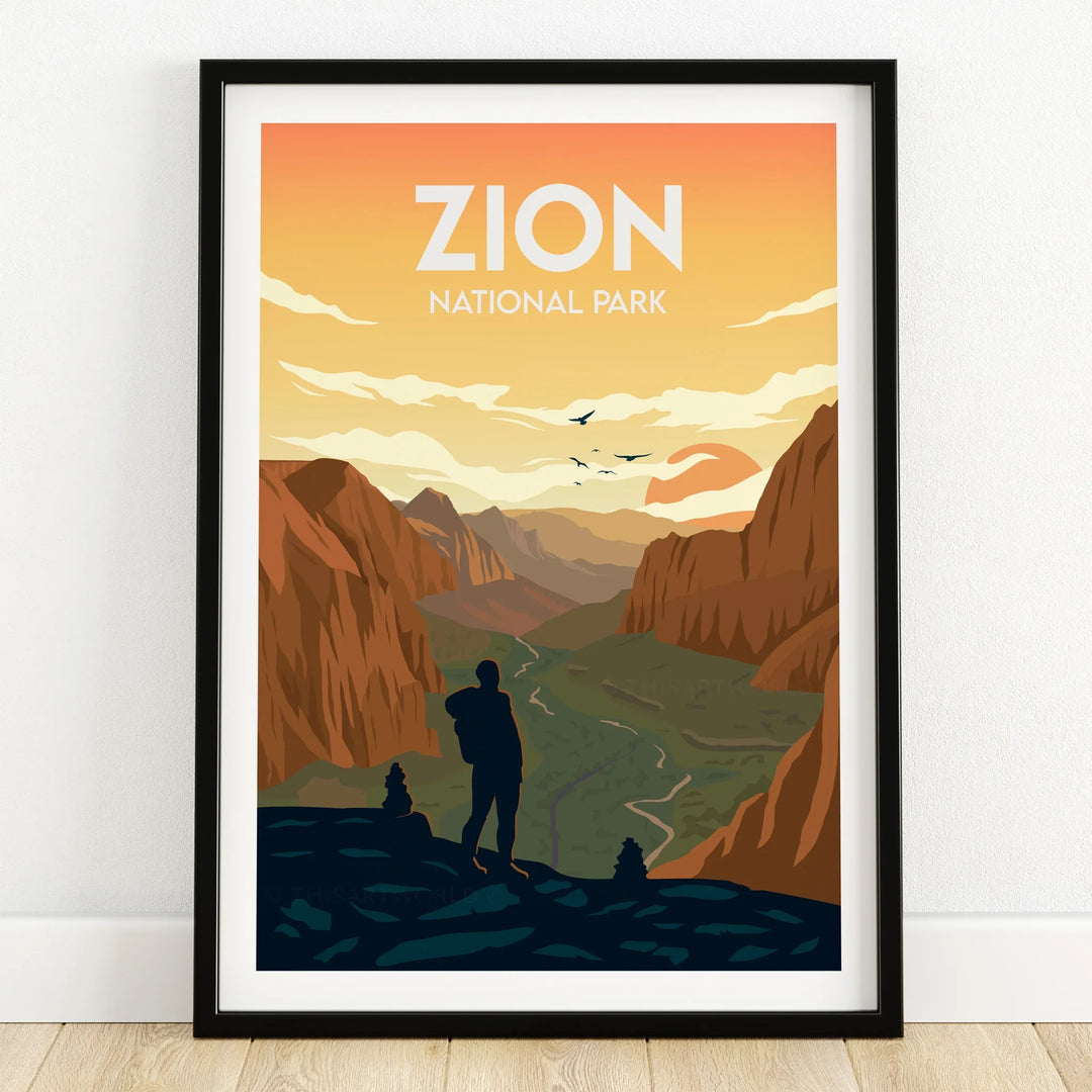 Zion National Park art print in black frame, featuring hiker silhouette and canyon landscape.