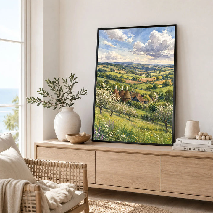 High Weald oast houses and orchard blossom watercolour art print framed in a living room