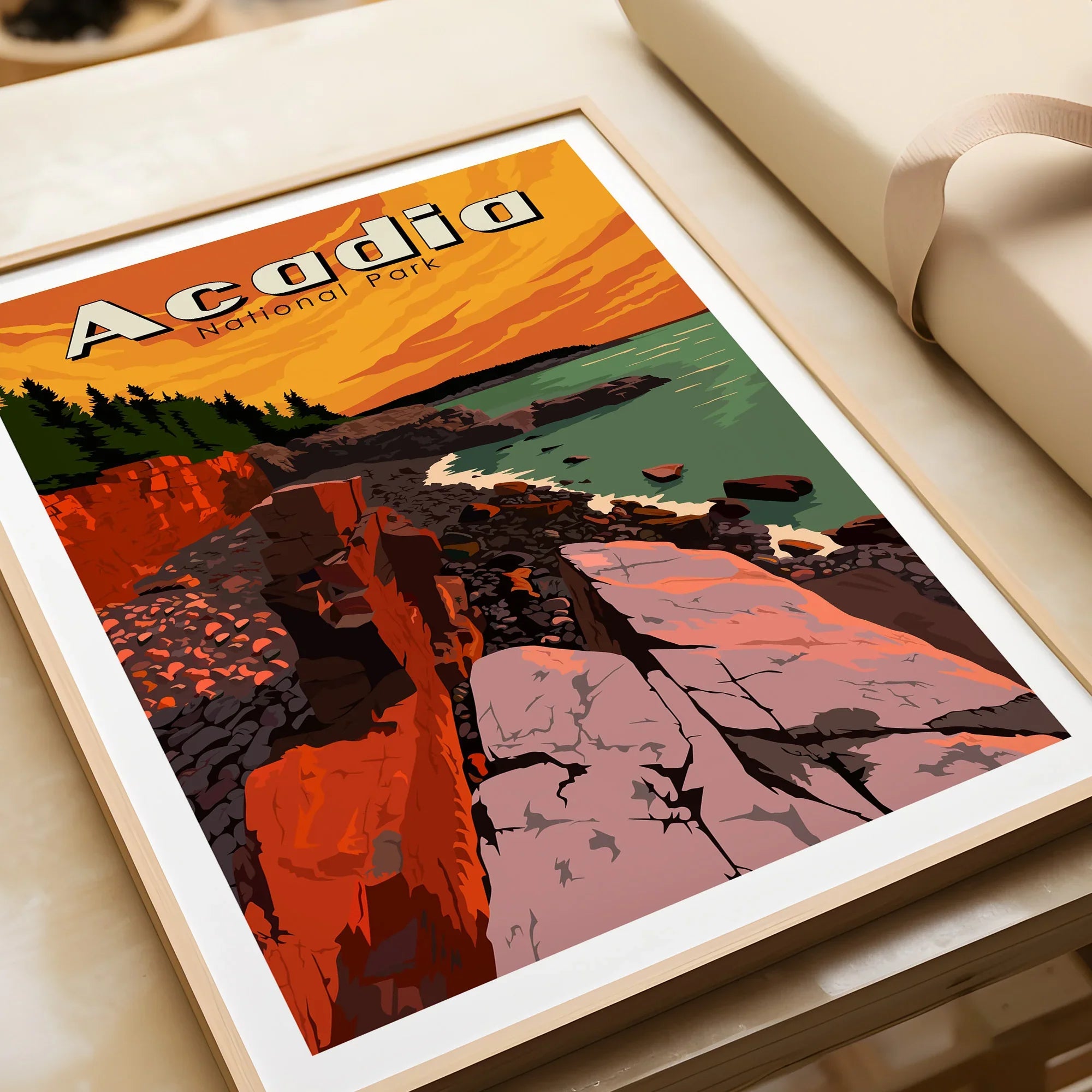 Framed Acadia National Park art print with rocky coastline and sunset colors, unwrapped for gifting
