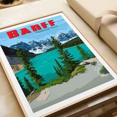 Framed Banff National Park art print with turquoise lake and mountains, unwrapped on table.