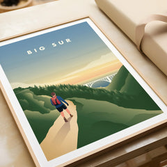 Framed Big Sur art print showing hiker on scenic trail at sunrise with forest and bridge