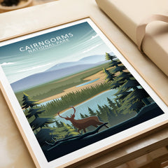 Cairngorms National Park travel poster with deer, lake, forest, and natural wood frame.