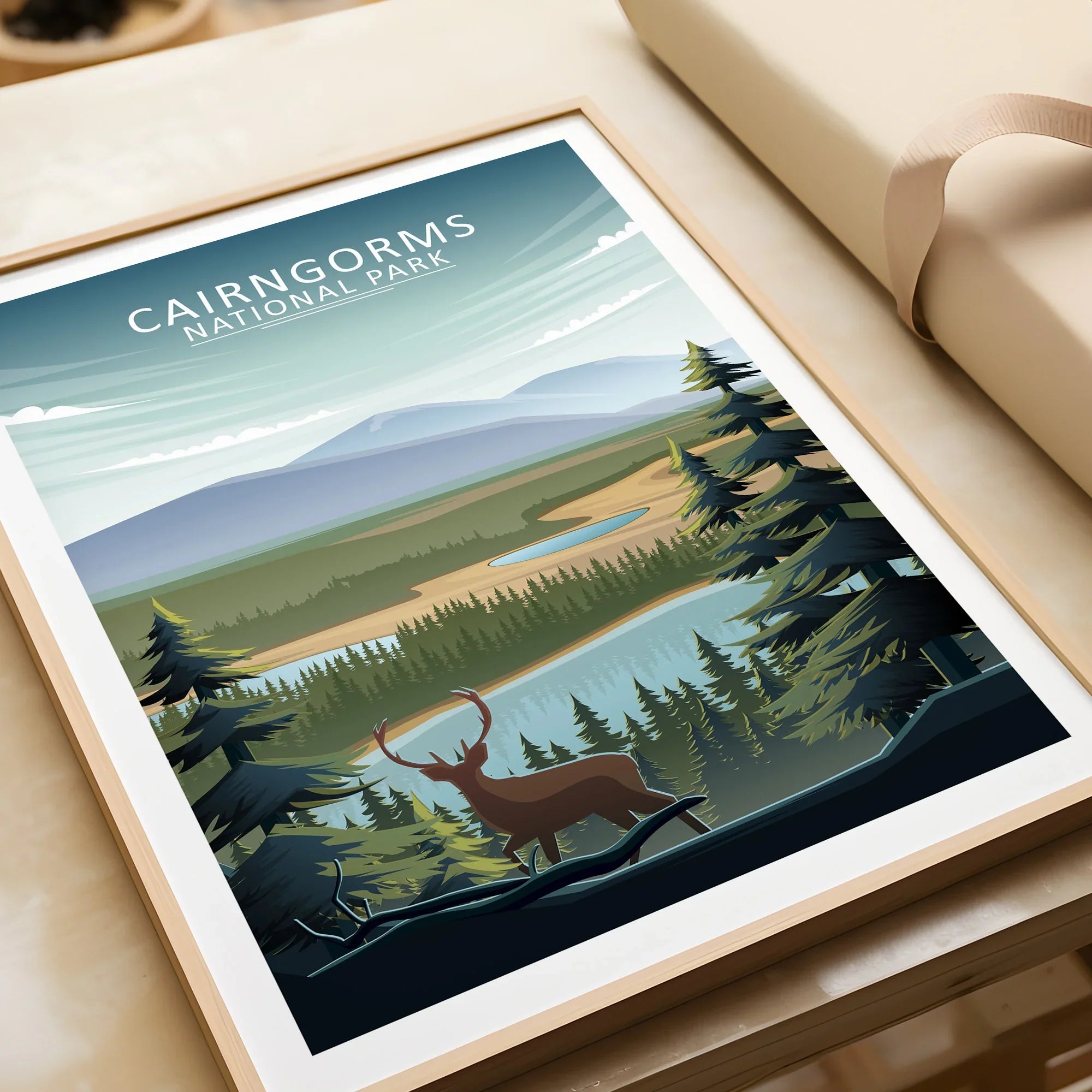 Cairngorms National Park travel poster with deer, lake, forest, and natural wood frame.
