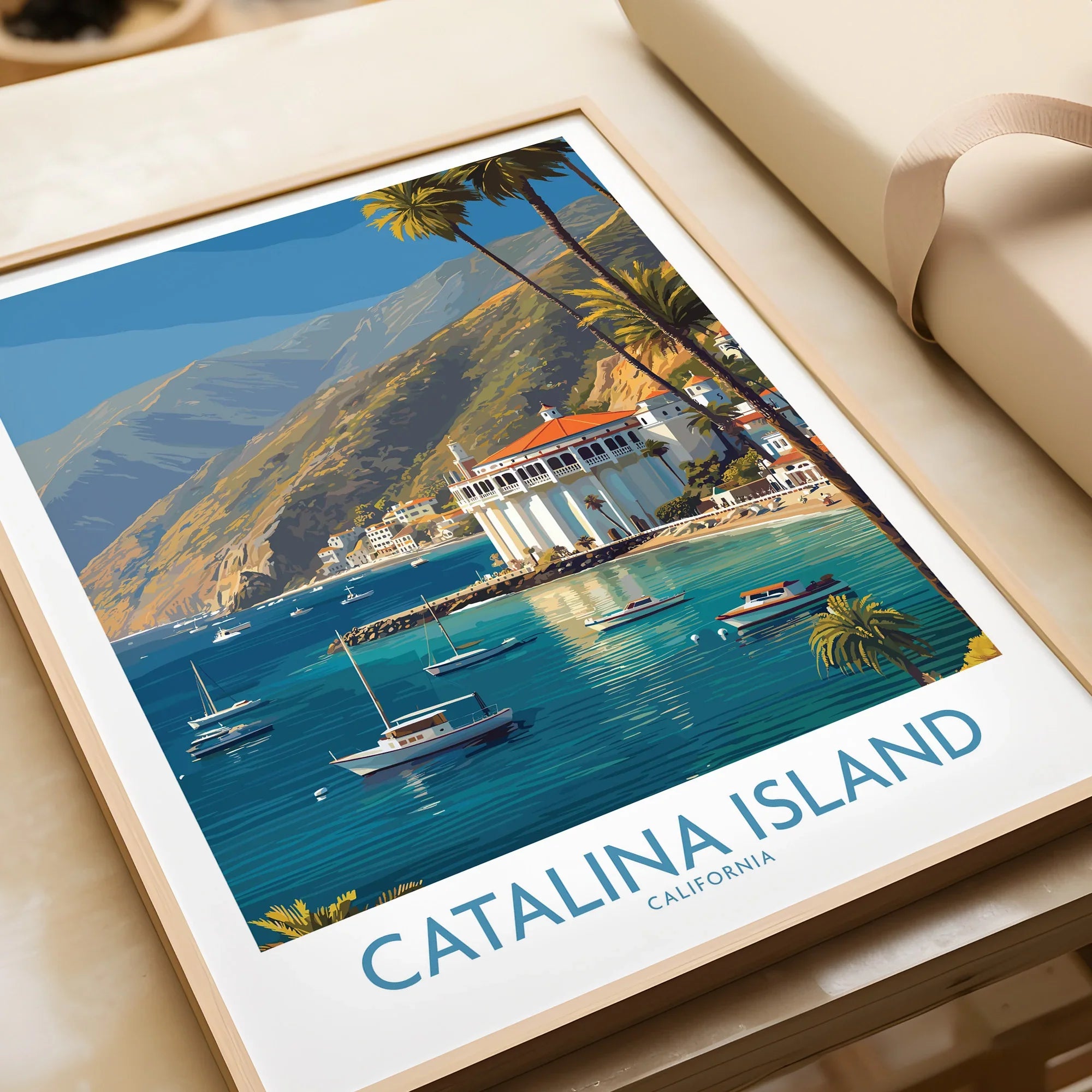 Catalina Island art print in natural wood frame, featuring boats, palm trees, and coastal scenery