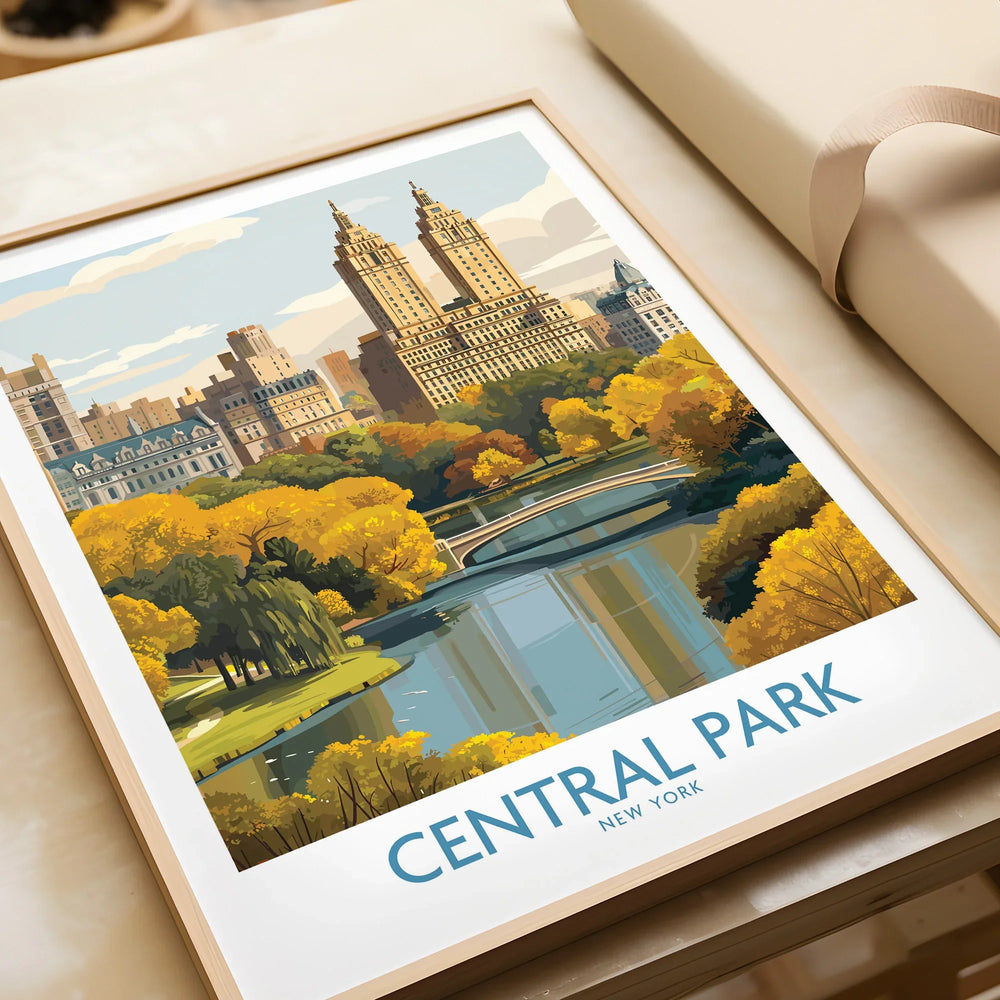 Framed Central Park New York art print with skyline and autumn trees, unwrapped on table.