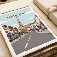 Colchester England travel poster framed art print featuring city street and clock tower