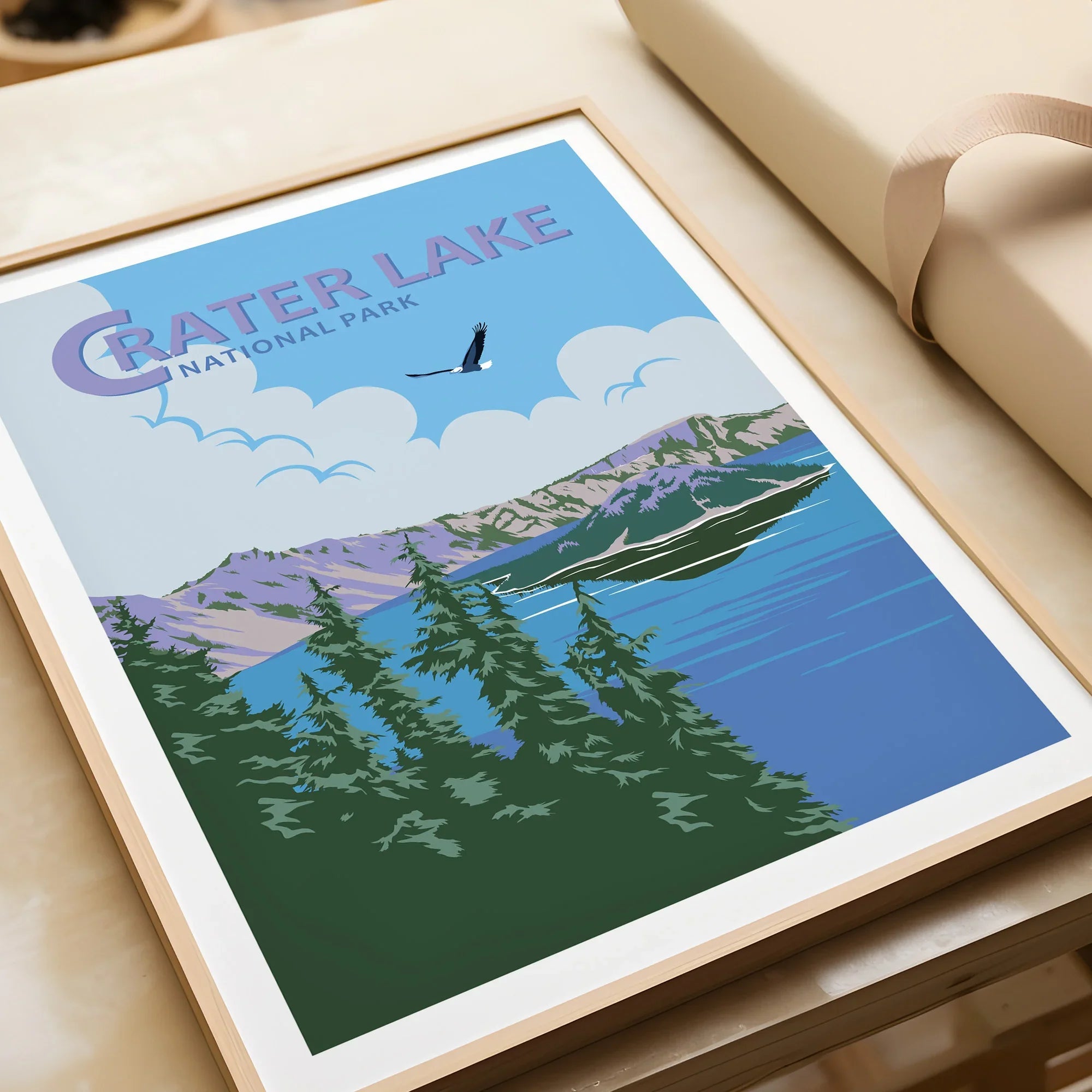 Framed Crater Lake National Park art print with pine trees, blue lake, and mountains.