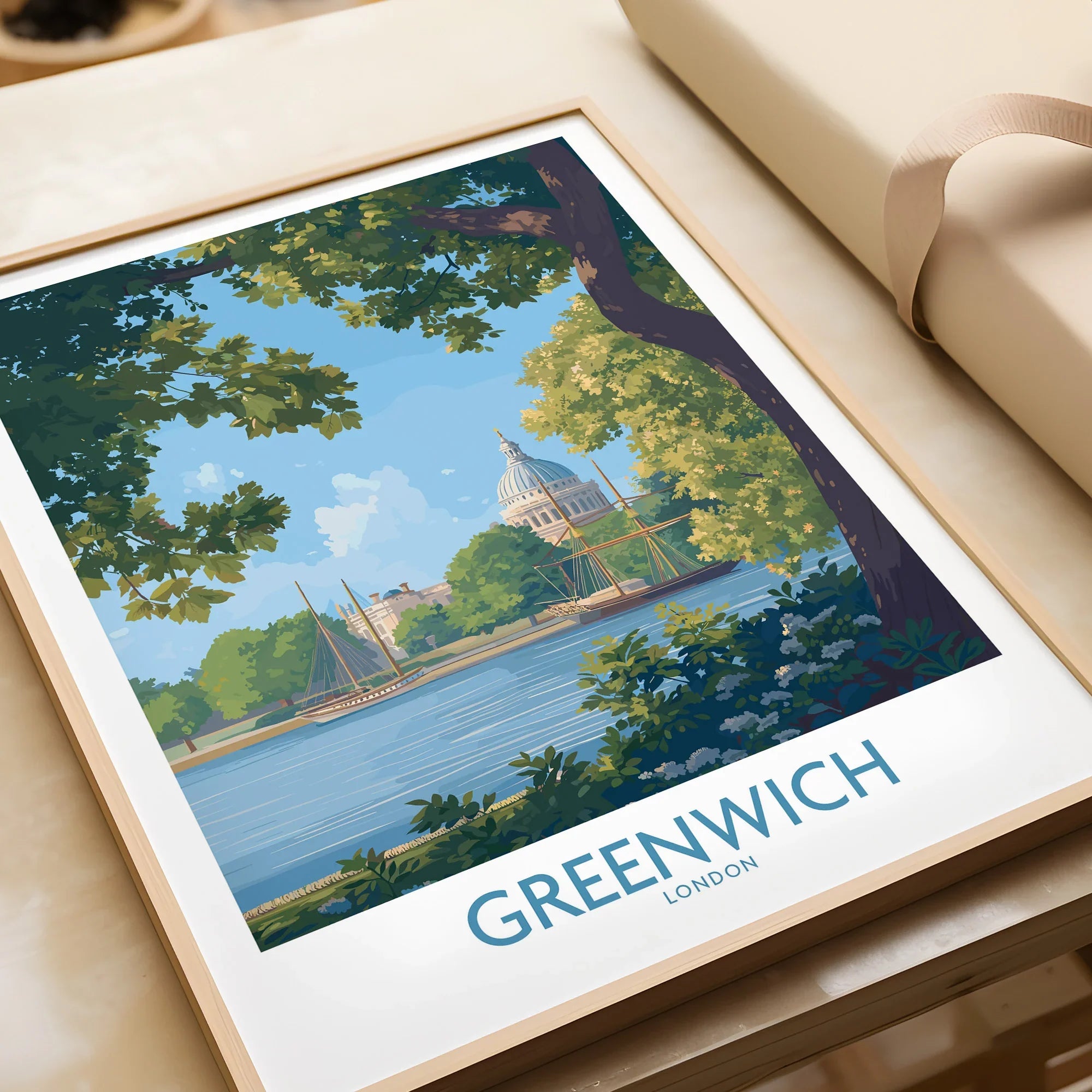 Greenwich London travel poster art print in natural wood frame, unwrapped on table