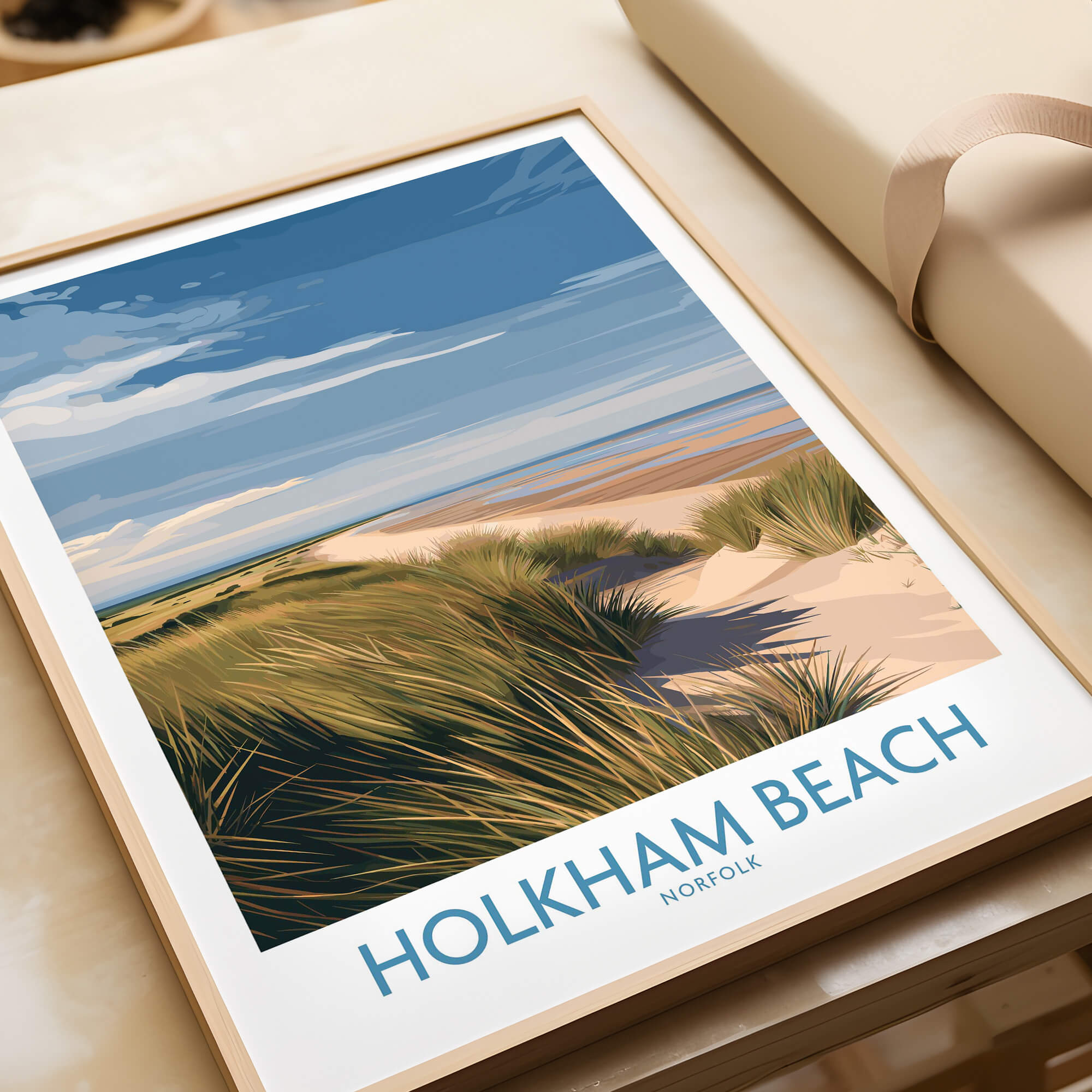 Holkham Beach Norfolk Canvas Print | Minimalist British Seaside Landscape Poster displayed on a wooden table.