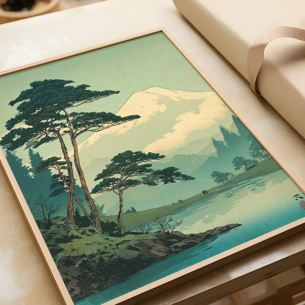 Framed art print of Japanese woodblock mountain landscape with trees and lake, unwrapped gift