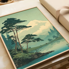 Framed art print of Japanese woodblock mountain landscape with trees and lake, unwrapped gift