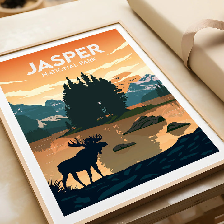Framed Jasper National Park print with moose, lake, mountains, and trees at sunset