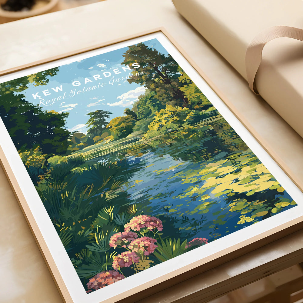 Framed Kew Gardens art print with lush landscape, pond, and wildflowers unwrapped on table