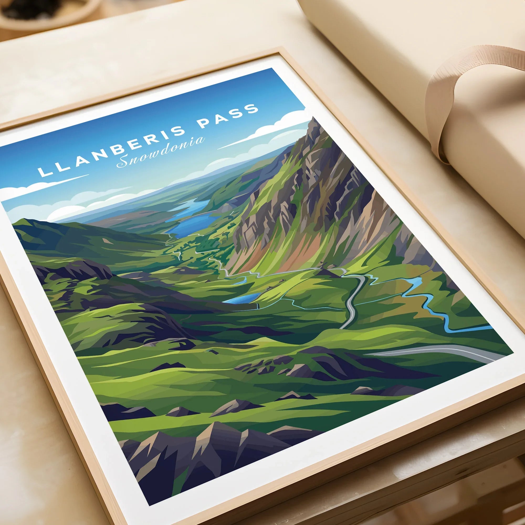 Framed Llanberis Pass Snowdonia travel poster art print closeup, unwrapped on table